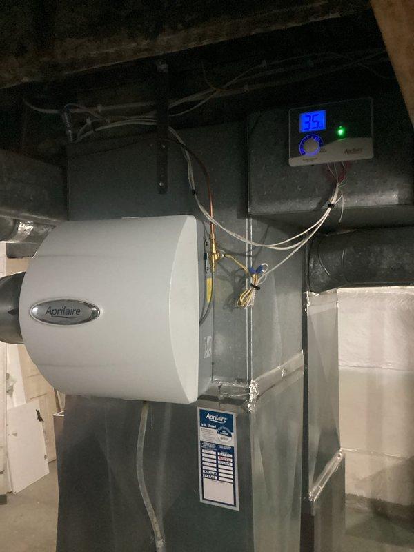 Responded to service call for non-functioning humidifier. Upon inspection of the Aprilaire unit mounted to ductwork, verified system was operating correctly with control panel displaying 35% humidity and green indicator light active. Provided customer education on proper humidifier operation and maintenance.