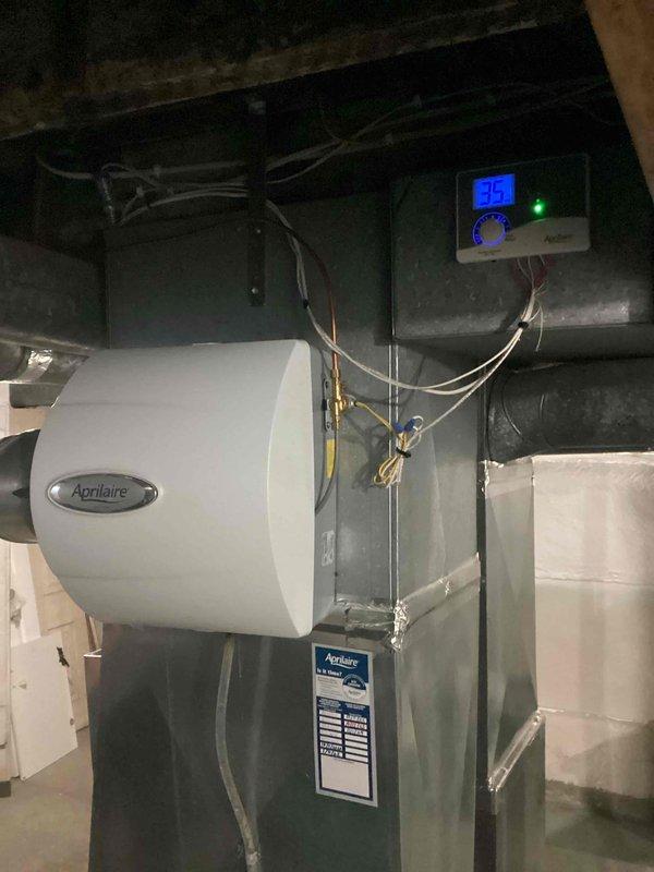 Responded to service call for non-functioning humidifier. Upon inspection of the Aprilaire unit mounted to ductwork, verified system was operating correctly with control panel displaying 35% humidity and green indicator light active. Provided customer education on proper humidifier operation and maintenance.