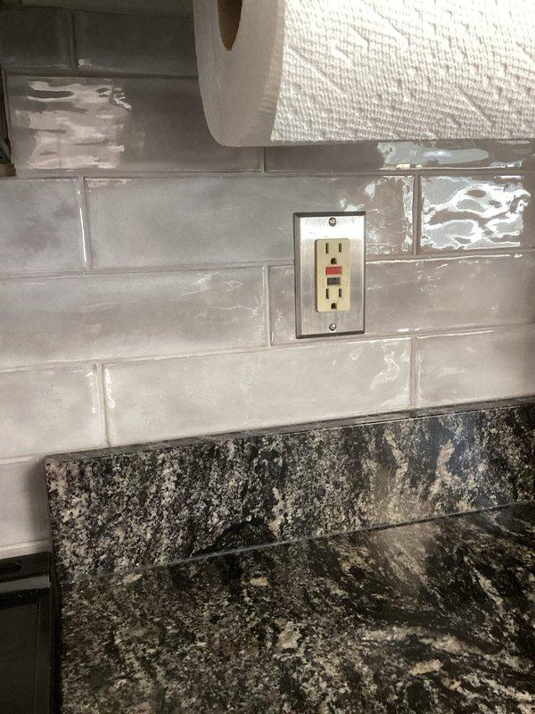 Performed comprehensive electrical safety inspection of residential property. Verified proper installation of GFCI outlets in required locations including kitchen area, inspected main electrical panel for code compliance, and confirmed presence of water bonding system. All systems found to be in satisfactory working condition with no safety issues identified.