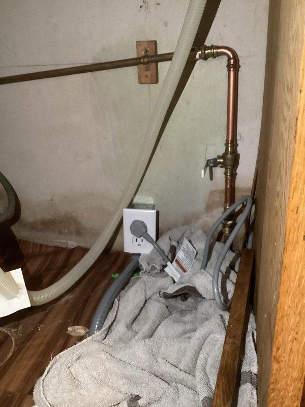 Installed new GFCI outlet under sink for dishwasher conversion from hardwired to plug-in configuration. Accessed ceiling in adjacent room with customer approval to route new electrical line, drilled access hole, and successfully completed wiring installation for proper appliance operation.