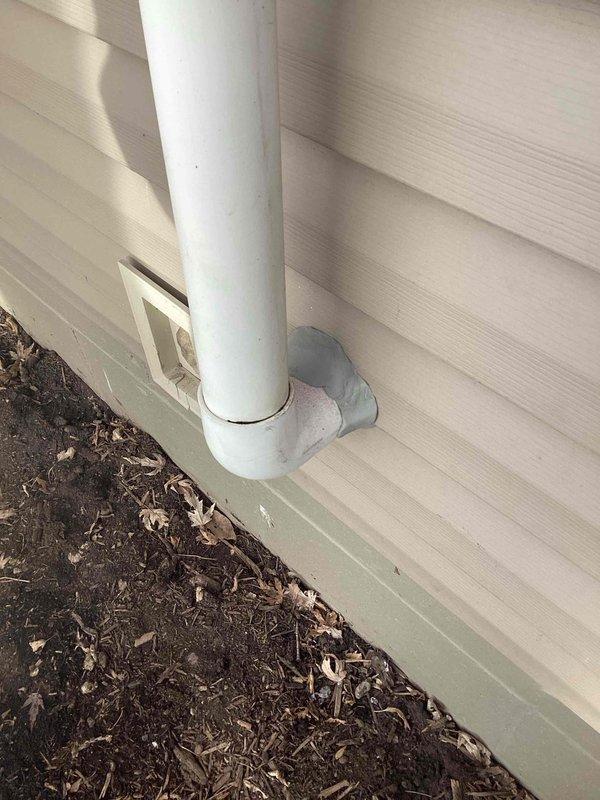 Applied thumb gum sealant around HVAC vent piping where it exits through the exterior vinyl siding to prevent water infiltration and ensure proper system ventilation.