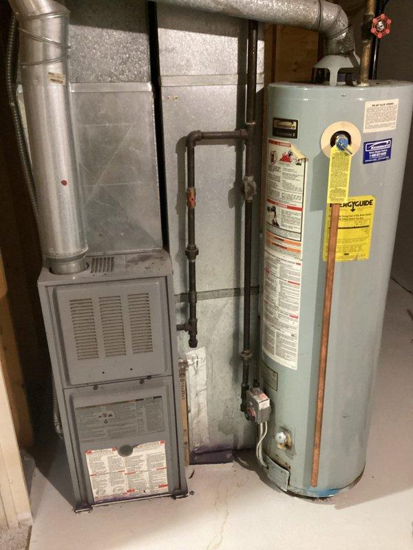 Performed site assessment for installation of fresh air intake to furnace. Inspected existing furnace and water heater setup in unfinished basement mechanical room. Evaluated space requirements and identified suitable location for combustion air intake to meet code requirements.