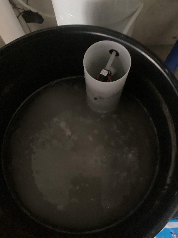 Diagnosed water softener system failure showing symptoms of standing water in brine tank and failure to drain during regeneration cycle. Inspected Impression (Water Right brand) control panel and internal components of brine tank, noting the float mechanism and vertical PVC pipe assembly. Determined need for follow-up service with senior technicians to fully resolve the drainage issue affecting regeneration functionality.