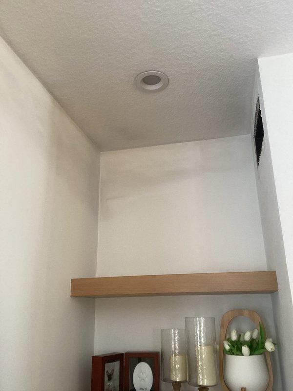 Responded to homeowner's concern regarding black soot in vents and on furnace filter. Upon inspection, discovered soot on walls was not originating from the furnace system. Homeowner will schedule separate service for fireplace inspection as likely source of soot issue.