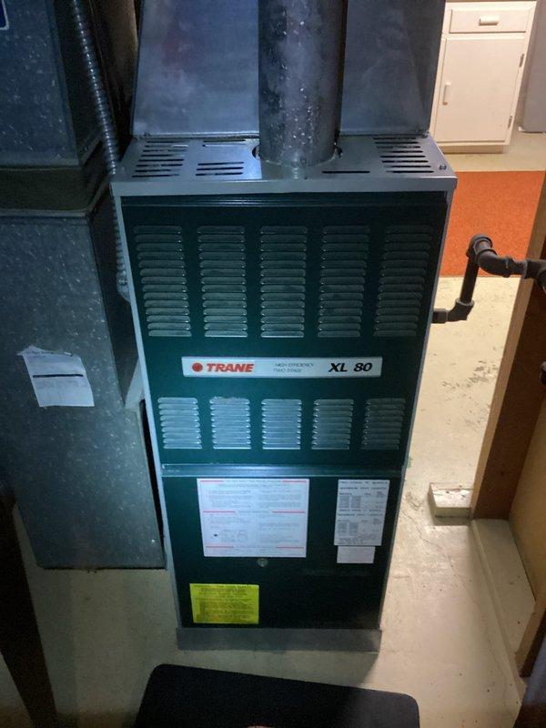 Arrived on schedule for prepaid HVAC maintenance on a Trane XL 80 furnace system. Performed complete tune-up service including system inspection, component testing, and cleaning. Noted and addressed frost accumulation on the exhaust pipe, which could indicate condensation issues requiring monitoring.