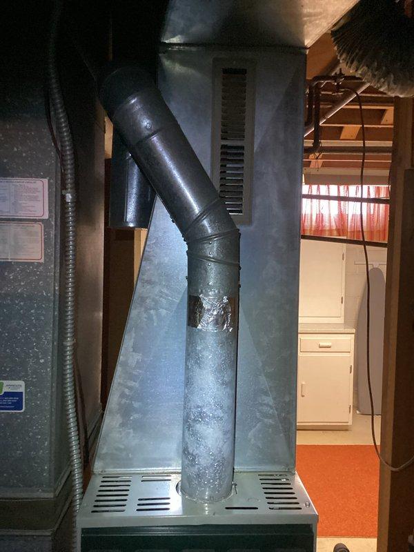 Arrived on schedule for prepaid HVAC maintenance on a Trane XL 80 furnace system. Performed complete tune-up service including system inspection, component testing, and cleaning. Noted and addressed frost accumulation on the exhaust pipe, which could indicate condensation issues requiring monitoring.