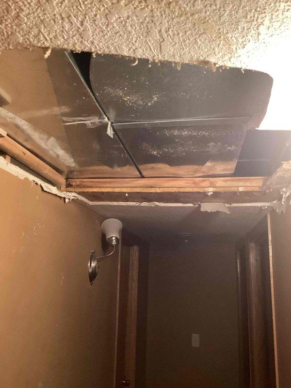 Responded to a water leak emergency in basement ceiling. Identified a leak in a 1/2" PEX water line located above HVAC ductwork. Diagnostic inspection revealed ductwork obstructing direct access to the damaged pipe. Recommended scheduling HVAC technician to remove ductwork to facilitate proper repair of the leaking water line.