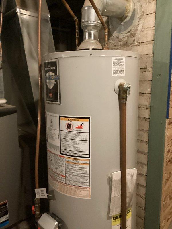 Responded to service call for non-functioning water heater with error code indicating thermostat issue. Reset tripped heat sensor and relit unit successfully. Identified internal tank leak evidenced by water accumulation around base of 40-gallon atmospheric vent water heater. Provided customer with replacement estimate via email.