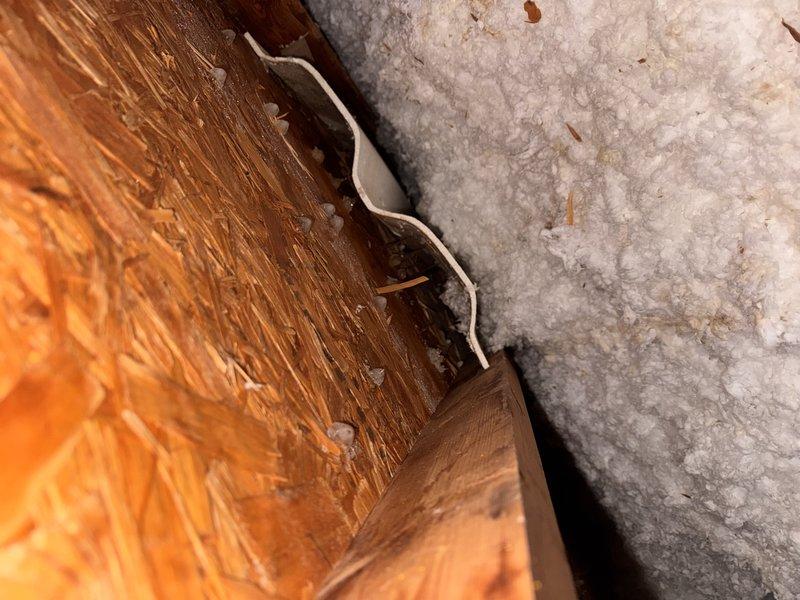 Responded to service call regarding bathroom fan leakage. Upon inspection, identified condensation forming on roof structure causing moisture issues. Visual examination revealed water penetration at junction between wooden structural elements and insulation. Scheduled estimate for replacement bathroom exhaust fan to properly address ventilation and prevent further moisture damage.