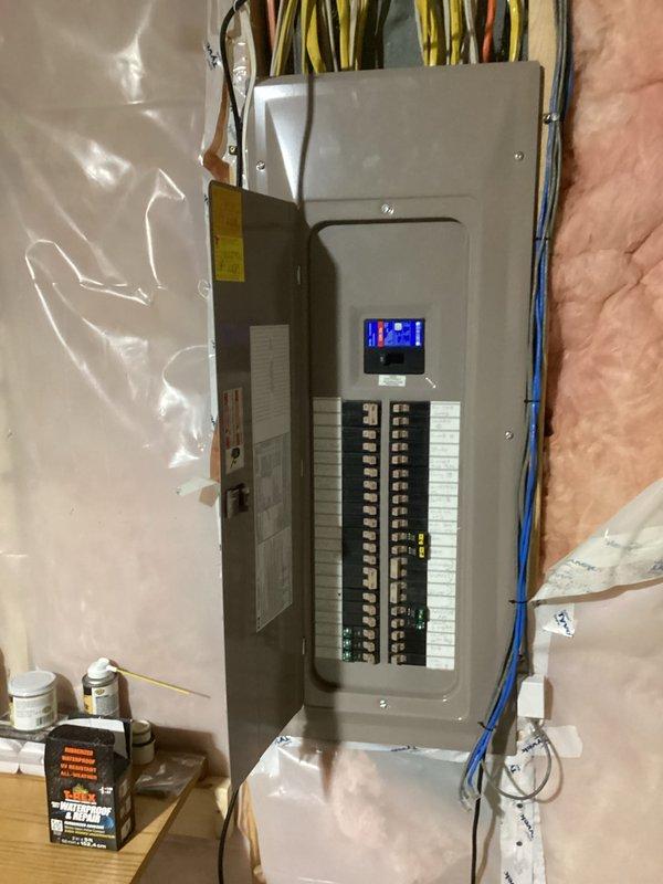 Installed a 15-amp circuit breaker in customer's panel to connect existing 12-gauge wiring for a dedicated sauna outlet in the utility room. Completed final connections and verified proper operation of the new circuit.