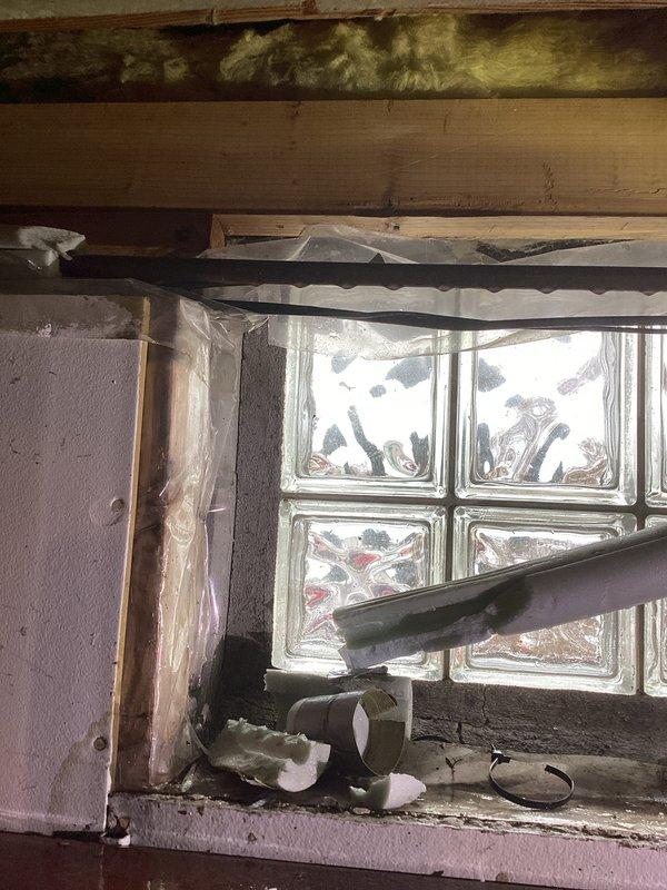 Responded to service call for water leak in garage. Located pinhole leak in 1/2" copper water line. Performed repair by cutting out damaged section and installing new copper pipe. Restored water service to home and verified proper operation.