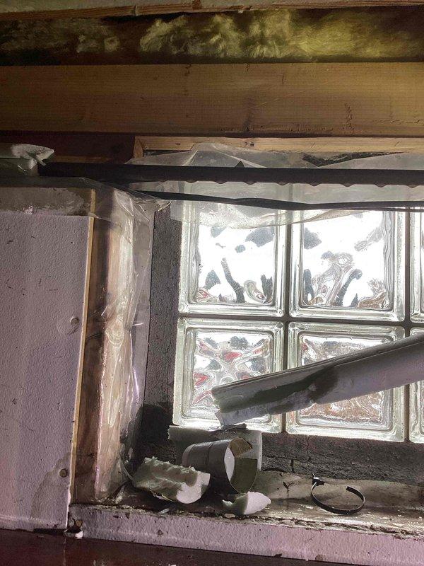 Responded to service call for water leak in garage. Located pinhole leak in 1/2" copper water line. Performed repair by cutting out damaged section and installing new copper pipe. Restored water service to home and verified proper operation.