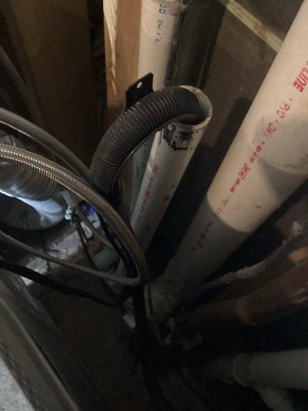 Responded to service call regarding low water pressure and a leaking drain line for washing machine. Upon inspection, confirmed good pressure at both hot and cold washing machine supply lines, indicating any pressure issues would be internal to the appliance requiring appliance specialist assessment. Tightened loose compression nut on P-trap connection of washing machine drain line to resolve the leak.