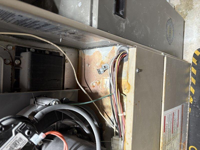 Performed comprehensive furnace tune-up on existing system showing signs of corrosion on internal components. Inspected gas meter connections and provided education to new homeowner regarding humidifier operation and maintenance. System operational despite age-related wear; no immediate repairs required.