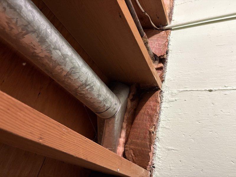 Responded to callback for bedroom heat issue previously serviced. Inspection revealed inadequate airflow to room with two exterior walls and two windows but only one supply vent. Observed ductwork in framing with proper insulation. Advised homeowner to keep door open to improve air circulation and heat distribution.