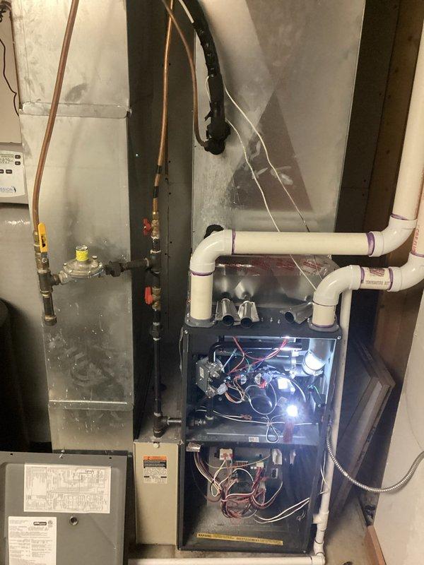 Responded to no heat complaint for LP furnace over 10 years old. Diagnosed tripped rollout switch due to excessive debris on burners. Service included removing burner assembly, performing thorough cleaning to restore proper flame pattern and combustion, then verifying safe operation after reassembly.