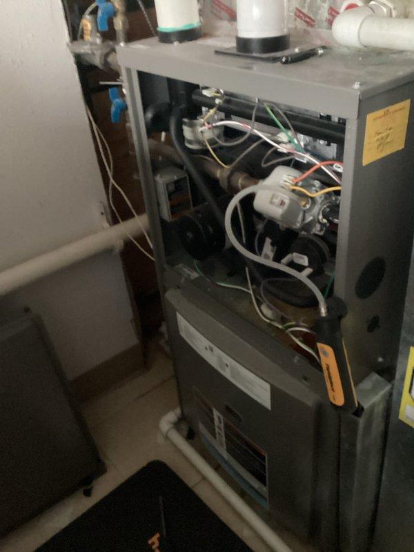 Performed furnace and humidifier tune-up, confirming system operation was within specifications. Visual inspection revealed a leak from a side plug on the furnace unit. Examined internal components, including control boards, wiring connections, and motor assembly. Inspected associated plumbing infrastructure and PVC ventilation pipes. Provided customer with estimate for leak repair.