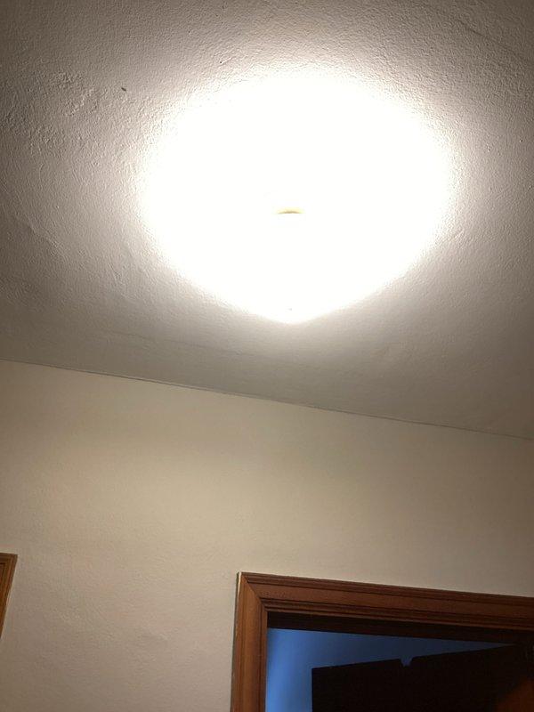 Installed three customer-provided overhead ceiling light fixtures. Completed testing and verified proper operation of all newly installed fixtures. Existing ceiling showed signs of cracking unrelated to electrical work.
