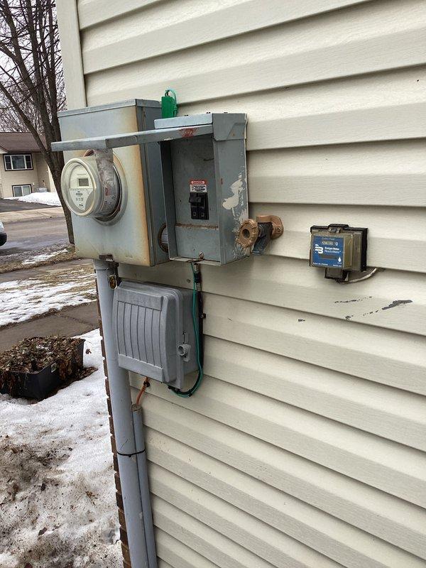 Responded to a no-power emergency affecting half of customer's home, including furnace (critical with small children present). Diagnostic testing revealed a faulty main breaker in the weathered exterior electrical service panel. Successfully replaced the defective main breaker, restoring full power to the residence.