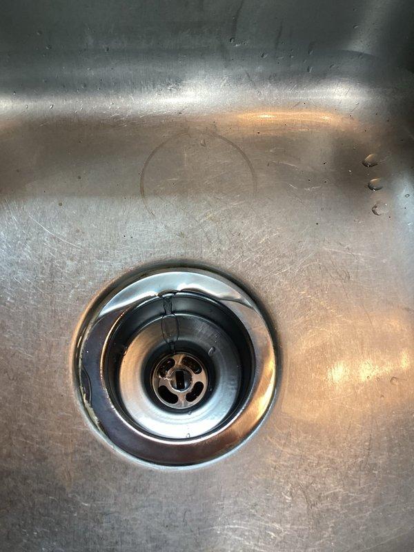 Diagnosed and repaired dual leaks at kitchen sink caused by defective basket strainers on both left and right sides. Removed damaged components and installed new basket strainers, restoring proper drainage function and eliminating leaks. Final testing confirmed successful repair with no further leakage issues.