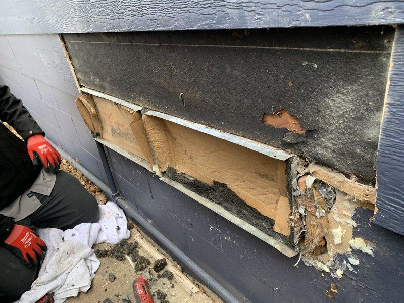 Responded to callback service request to address deteriorated building materials in wall structure. Removed damaged cap as requested and delivered to Bruce for fabrication of replacement. Documented significant deterioration of wall materials including exposed wooden components and compromised insulation. Will return to install new custom caps once fabrication is complete.