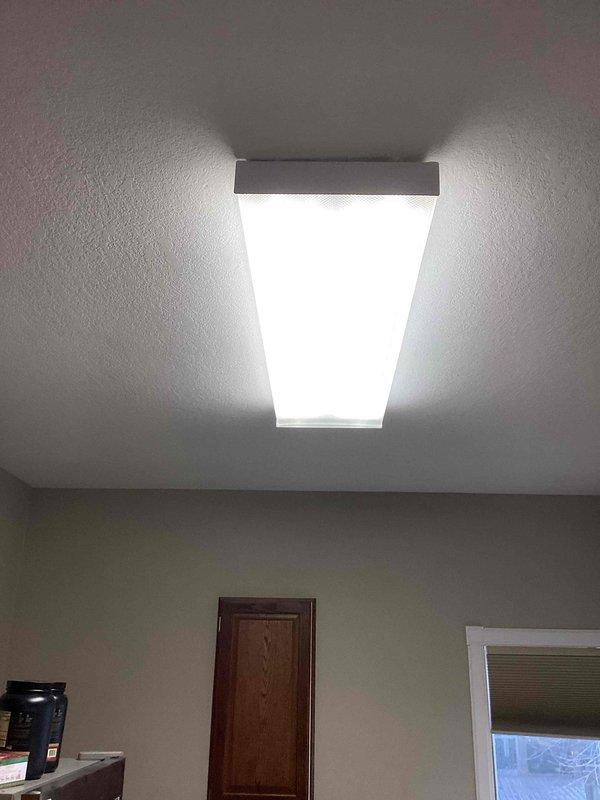 Responded to service call regarding a 4-bulb fluorescent fixture experiencing burnout issues. Diagnosed problem, removed ballast, and replaced with new LED bulbs. Successfully restored proper illumination to the ceiling fixture.
