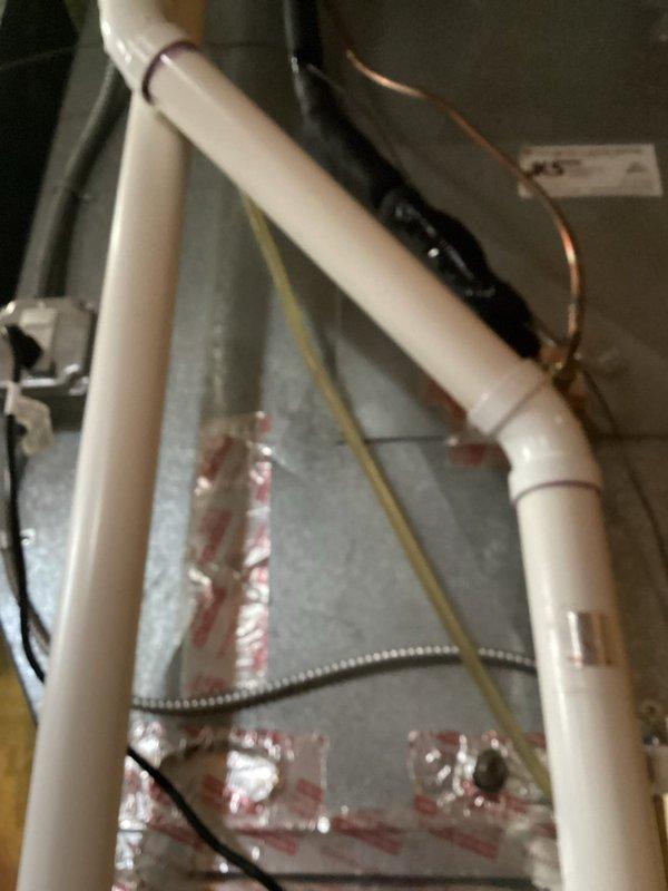 Performed scheduled maintenance tune-up on HVAC system. Inspected equipment including air handler and associated plumbing connections. Noted minor corrosion on piping near unit (equipment ID: S870424/AMVW970050BN). All systems functioning properly after service completion.