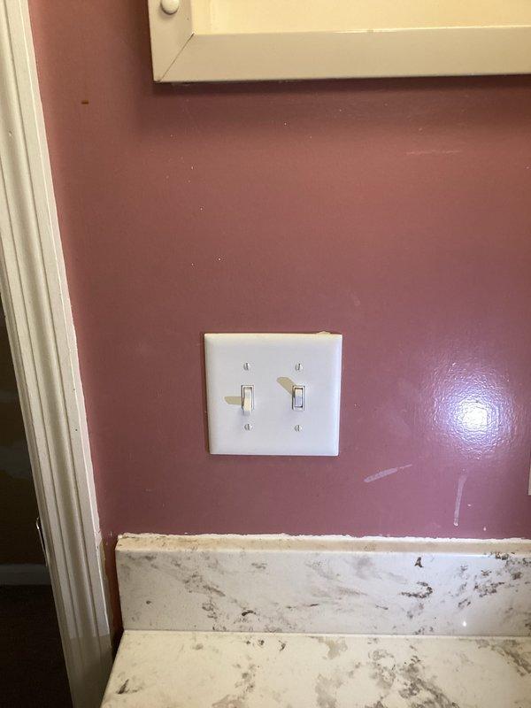Installed new electrical outlet in upstairs hallway closet to accommodate rechargeable vacuum cleaner. Ran electrical wire through attic from existing bathroom switch location to new outlet location. Completed installation with proper connections to existing circuit.
