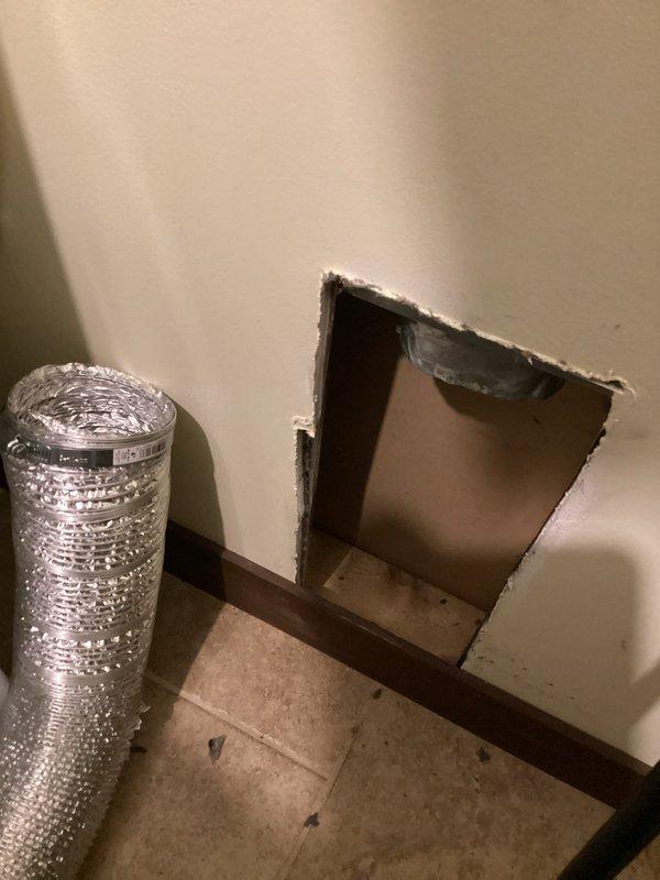 Responded to service call regarding a disconnecting dryer vent. Upon inspection, determined the wall vent pipe was insufficient in length to properly connect through the access panel. Extended the dryer vent duct at a 45-degree angle to ensure secure connection and proper ventilation.