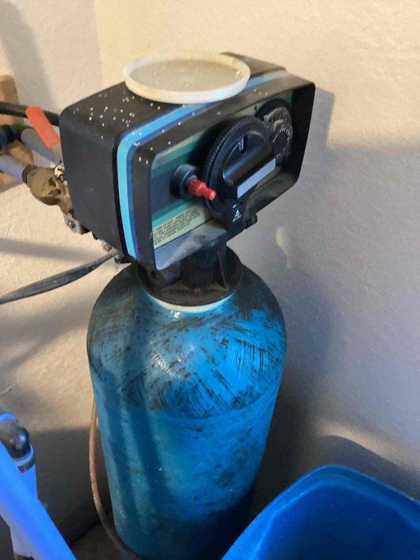 Performed diagnostic service on water softener system. Manually cycled unit through all five regeneration steps to verify proper operation. Adjusted system time from incorrect setting of 8:30pm to current time and increased hardness setting from 20 to 25 for optimal performance.