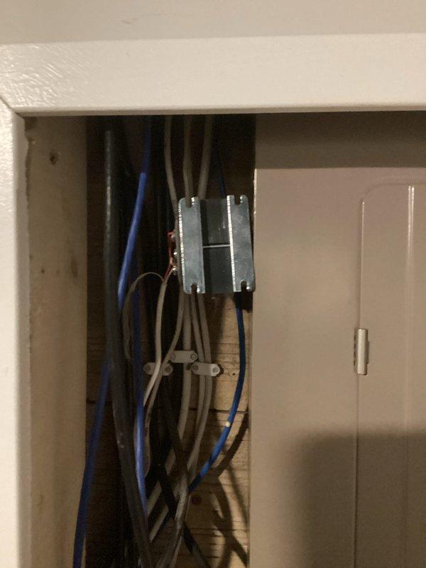 Responded to service call for doorbell transformer issue. Upon inspection, found transformer dangling from electrical panel. Secured and properly reinstalled transformer into panel, restoring doorbell functionality.