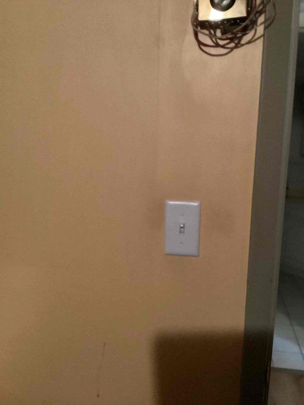 Responded to service call regarding electrical fixture issues. Diagnosed and replaced a faulty switch in the basement that was causing light to flicker, turn on/off intermittently, and produce hissing sounds. Additionally inspected exterior light switch, found it defective, and replaced it while securing loose connections to restore proper functionality.