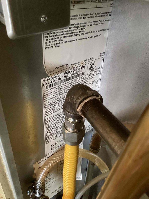 Serviced 10+ year old Nortek mobile home furnace (Model MG2S-08F2A8M1) that was shutting off intermittently and had water accumulation in the discharge line from fan area. Diagnosed and cleaned dirty flame sensor and cleared clogged inducer hoses, restoring proper operation. Recommended regular maintenance to prevent similar issues in the future.