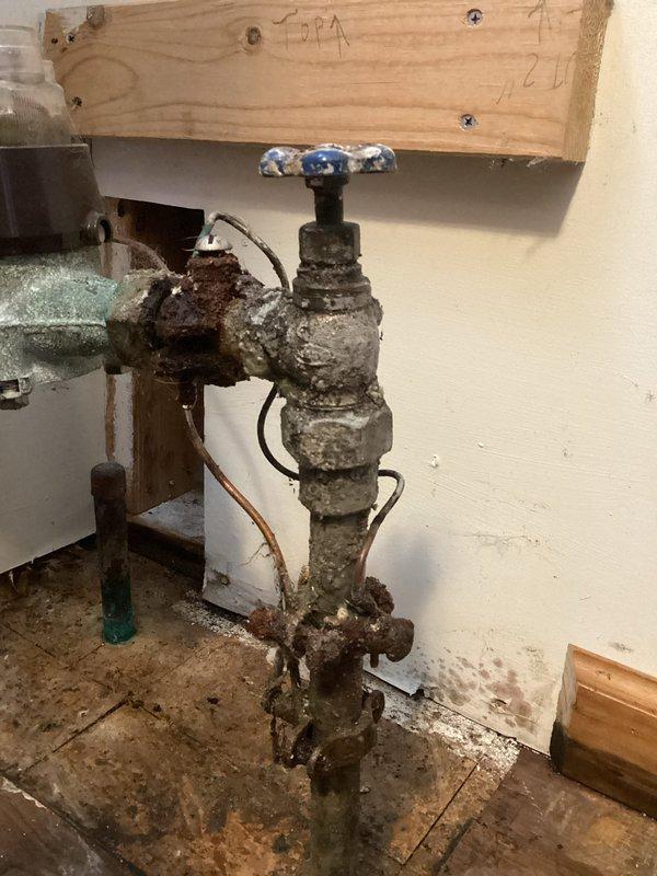 Responded to service call for water main leak after meter. Inspection revealed heavily corroded 3/4" gate valve with significant deterioration and mineral buildup causing active leakage. Coordinated with city water authority to shut off water supply to replace the damaged flared meter stop.