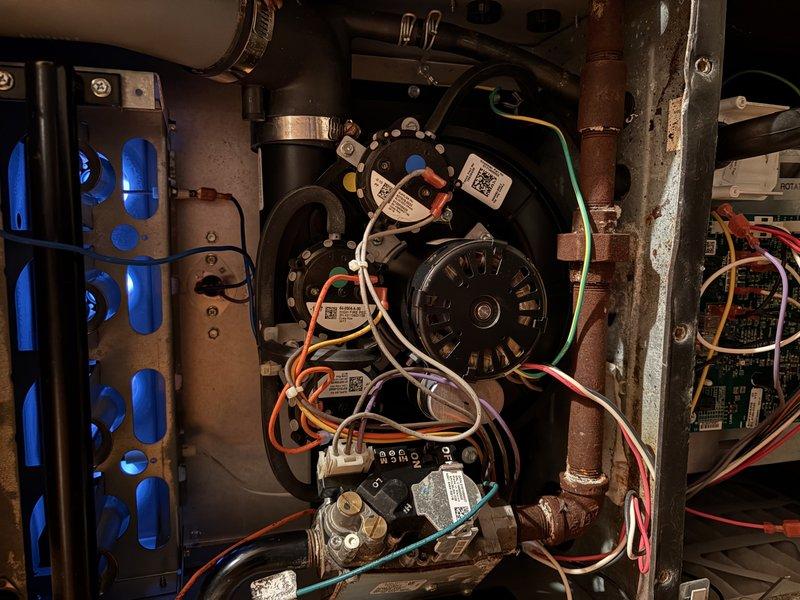 Diagnosed no heat complaint and identified failed inducer motor as root cause. Replaced inducer motor assembly, reconnected electrical connections, and verified proper system operation with successful heat cycle.