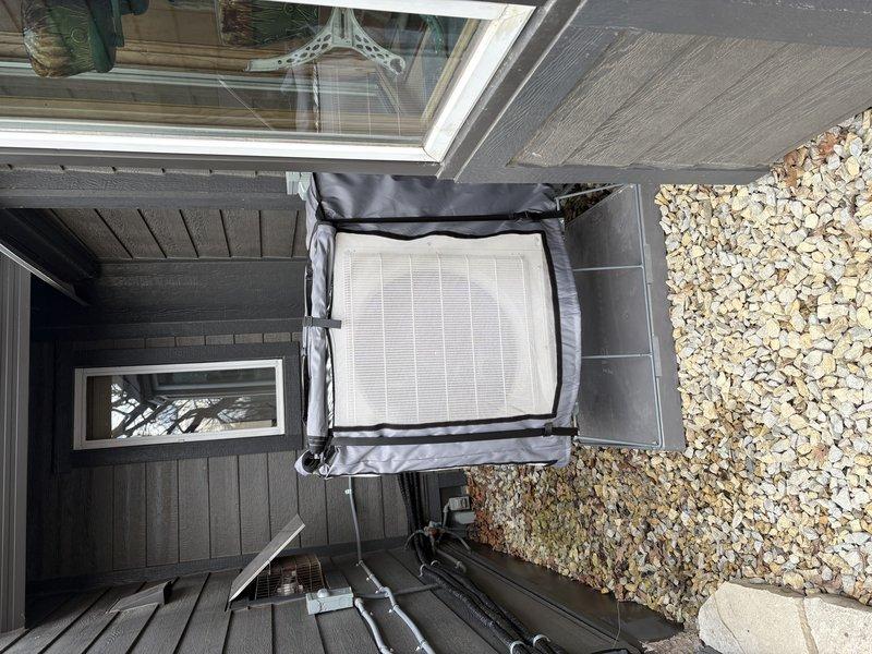 Performed scheduled mini-split system tune-up on two outdoor condenser units per maintenance agreement. Units were properly installed on concrete pad with adequate clearance and appropriate weatherproof covers. Service included comprehensive preventative maintenance according to manufacturer specifications.