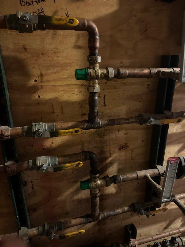 Successfully installed mixing valve and auto fill on boiler system, configured to maintain 15 psi operating pressure. Completed comprehensive installation of copper piping with multiple control valves on the distribution manifold, ensuring proper integration with the existing expansion tank.