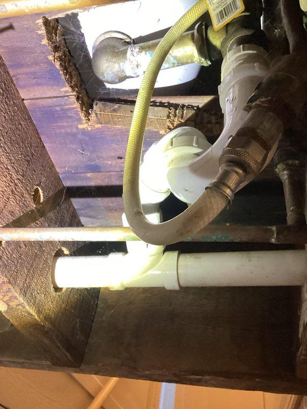 Responded to service call for tub drain leak in rental property. Upon inspection, identified a crack in the brass shoe fitting of the tub drain causing water leakage. Removed entire drain waste and overflow assembly and installed new components. Tested by running tub water; confirmed proper function with no leaks.