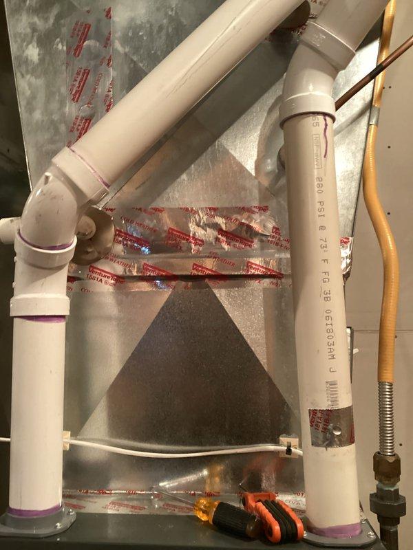 Completed scheduled preventative maintenance agreement service on air handler system. Performed comprehensive tune-up of all components with no issues identified. Documented equipment details including serial number S872523 and model AMES9608080BN, and inspected condensate drain system with properly installed PVC piping.