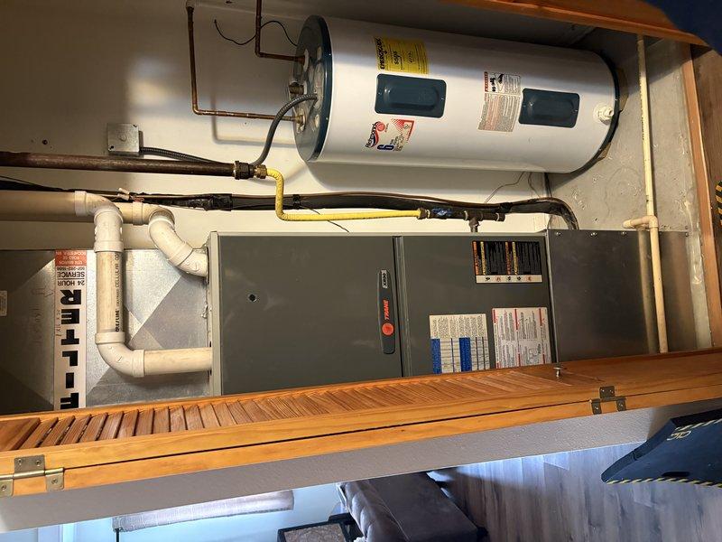 Responded to service call for non-functioning furnace. Diagnostic inspection revealed system had overheated due to clogged filter. Replaced air filter, performed complete system maintenance, and verified proper operation. Unit is now functioning correctly with new filter installed.