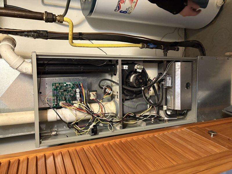 Responded to service call for non-functioning furnace. Diagnostic inspection revealed system had overheated due to clogged filter. Replaced air filter, performed complete system maintenance, and verified proper operation. Unit is now functioning correctly with new filter installed.
