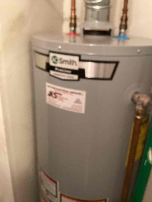 Responded to no hot water complaint for Smith tanked water heater. Diagnosed tripped heat sensor as cause of pilot light failure. Reset heat sensor which successfully restored pilot light function and hot water service. Unit now operating properly with all systems verified.