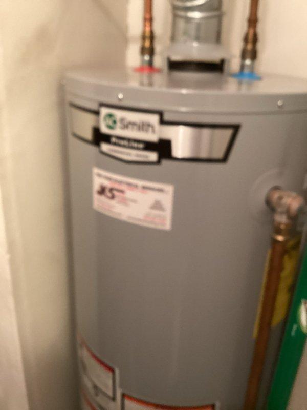 Responded to no hot water complaint for Smith tanked water heater. Diagnosed tripped heat sensor as cause of pilot light failure. Reset heat sensor which successfully restored pilot light function and hot water service. Unit now operating properly with all systems verified.