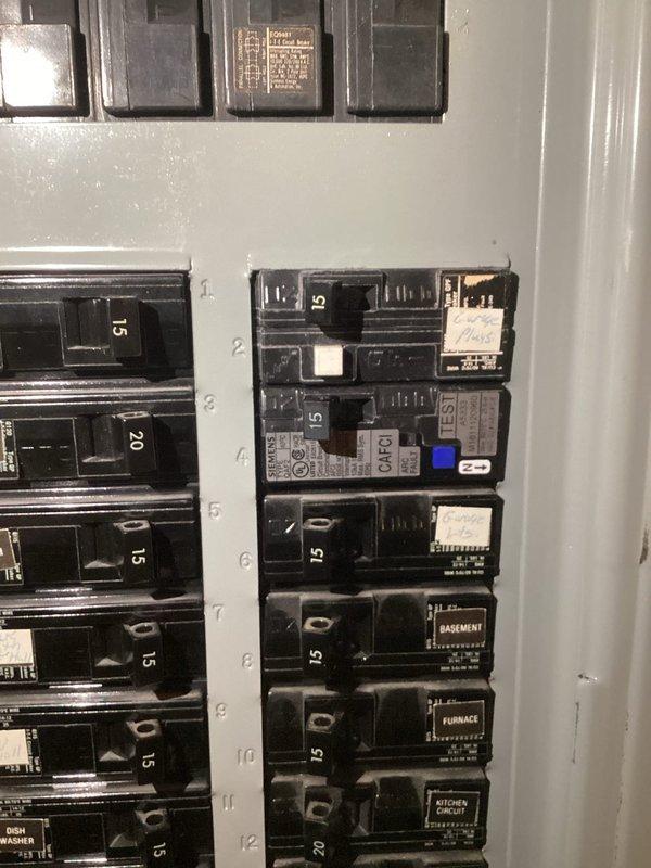 Responded to service call for power outage in garage outlets. Diagnosed issue as tripped circuit breaker in main electrical panel. Reset tripped breaker to restore power to all affected outlets in garage.