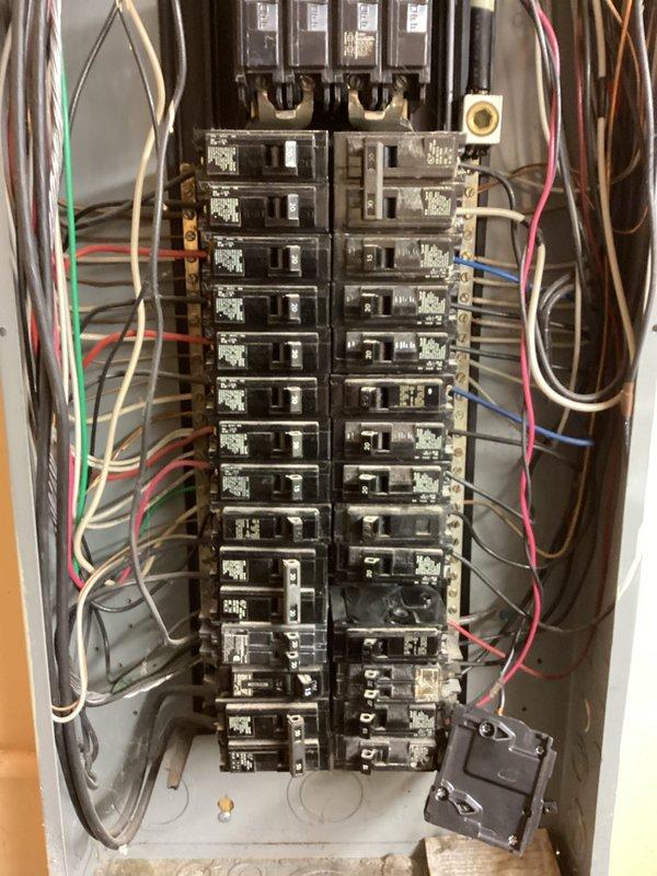 Responded to service call for non-functioning circuit breaker in residential panel. Upon inspection, discovered burnt bus bar and recommended installation of tandem breaker. Customer opted to complete installation independently after technical assessment and guidance were provided.