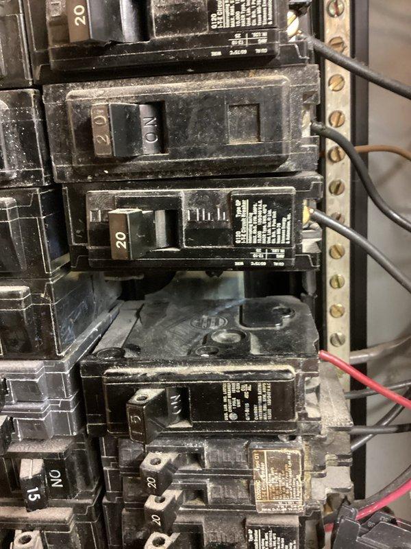 Responded to service call for non-functioning circuit breaker in residential panel. Upon inspection, discovered burnt bus bar and recommended installation of tandem breaker. Customer opted to complete installation independently after technical assessment and guidance were provided.