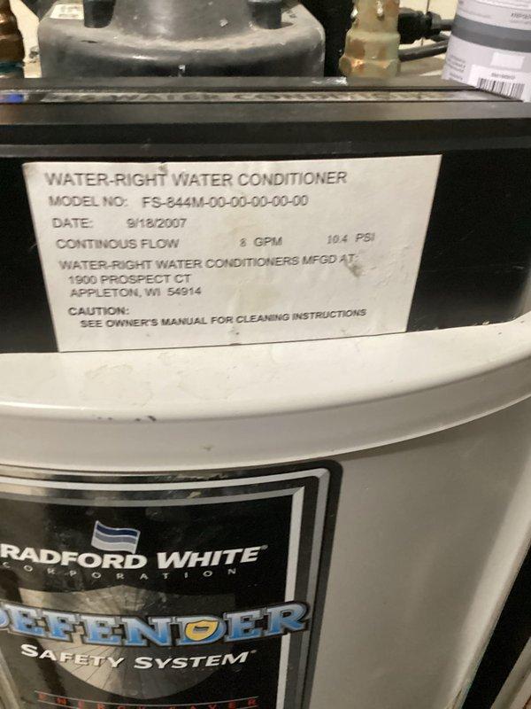 Diagnosed Water-Right Water Conditioner (model FS-244M-00-00-00) from 2007 that was stuck in service mode, continuously filling the brine tank and leaking through the overflow. After consultation with manufacturer, determined replacement parts are no longer available for this 16-year-old unit. Provided customer with estimate for replacement system.
