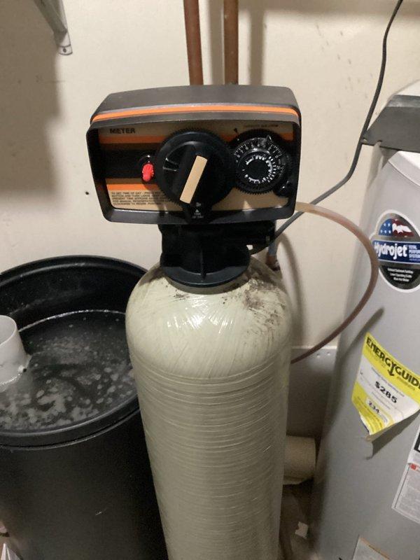 Diagnosed Water-Right Water Conditioner (model FS-244M-00-00-00) from 2007 that was stuck in service mode, continuously filling the brine tank and leaking through the overflow. After consultation with manufacturer, determined replacement parts are no longer available for this 16-year-old unit. Provided customer with estimate for replacement system.