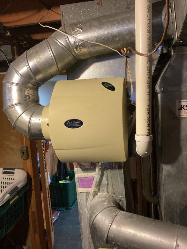 Responded to service call for Aprilaire humidifier leaking issue. Upon inspection, discovered humidifier pad was incorrectly installed by previous technician. Properly repositioned the evaporator pad in the humidifier unit and verified proper operation with no further leakage.