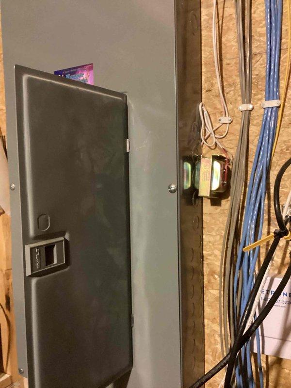 Diagnosed non-functioning smart doorbell system and identified missing wire connection. Accessed electrical panel to trace wiring pathway, then successfully reconnected necessary wires to restore power to the device. Video doorbell now receiving proper voltage and functioning as intended.